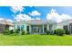 The backyard features green grass and a patio at 15722 San Lazzaro Ave, Lakewood Ranch, FL 34211