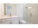 Bathroom featuring white cabinets with gold hardware, a modern sink, and glass enclosed shower at 15722 San Lazzaro Ave, Lakewood Ranch, FL 34211