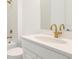 Bathroom featuring white cabinets with gold hardware, a tub, and a faucet with gold finish at 15722 San Lazzaro Ave, Lakewood Ranch, FL 34211