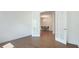 Bright formal dining room with hardwood floors viewed through open french doors at 15722 San Lazzaro Ave, Lakewood Ranch, FL 34211