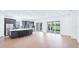 Bright and spacious living area featuring hardwood floors, natural light, and an open concept layout at 15722 San Lazzaro Ave, Lakewood Ranch, FL 34211