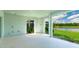 This covered patio has recessed lighting and views of the pond and landscaping at 15722 San Lazzaro Ave, Lakewood Ranch, FL 34211