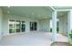 A view of the covered patio showing recessed lighting, tile floor and glass doors at 15722 San Lazzaro Ave, Lakewood Ranch, FL 34211
