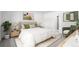 Cozy bedroom with a neutral color palette, plush bedding, and natural light at 16085 Edina Ave, Port Charlotte, FL 33954