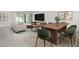 Bright open-concept living area and dining room with lots of natural light and luxury vinyl floors at 16085 Edina Ave, Port Charlotte, FL 33954