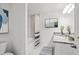 Bathroom boasts a shower-tub combo, granite countertop, and trendy decor for a modern design at 16206 Arcaro Ave, Port Charlotte, FL 33954