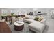 Open-concept living room with dining area, modern decor, and seamless flow to the kitchen at 16206 Arcaro Ave, Port Charlotte, FL 33954