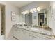 Bathroom featuring a large vanity, granite countertop and modern fixtures at 1622 Stafford Ln # 1205, Sarasota, FL 34232