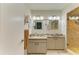 Bright bathroom with double vanity, granite countertops, and a glass-enclosed shower at 1622 Stafford Ln # 1205, Sarasota, FL 34232
