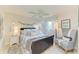 Serene bedroom with a queen bed, soft colors, and natural light at 1622 Stafford Ln # 1205, Sarasota, FL 34232