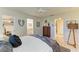 Bedroom features a walk-in closet, attached bathroom, and decorative furnishings at 1622 Stafford Ln # 1205, Sarasota, FL 34232