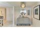 Chic entryway featuring a stylish console table, decorative mirror, and modern lighting at 1622 Stafford Ln # 1205, Sarasota, FL 34232