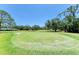 Well-maintained golf course with mature trees and lush green grass at 1622 Stafford Ln # 1205, Sarasota, FL 34232