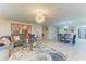 Open concept living area with stylish furniture, modern lighting and decor throughout the home at 1622 Stafford Ln # 1205, Sarasota, FL 34232