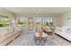 Inviting sunroom bathed in natural light with comfortable seating, and peaceful views of the outdoors at 1622 Stafford Ln # 1205, Sarasota, FL 34232