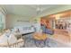 Bright and airy living room with comfortable seating, stylish decor, light-colored flooring, and an open floor plan at 1622 Stafford Ln # 1205, Sarasota, FL 34232