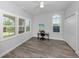 Bedroom with shutters on the windows and wood floors at 212 Milan W Ave # 1, Venice, FL 34285