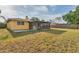 Home's backyard featuring lawn and an enclosed patio at 2151 Upton Ave, Sarasota, FL 34232