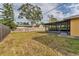 Spacious backyard featuring lawn and an enclosed patio at 2151 Upton Ave, Sarasota, FL 34232
