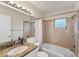 Bathroom featuring a tub and shower combo with a granite countertop sink at 2151 Upton Ave, Sarasota, FL 34232