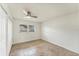 Bright bedroom featuring tile flooring, a ceiling fan, and a window for natural light at 2151 Upton Ave, Sarasota, FL 34232