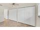Bedroom featuring tile flooring and spacious white bi-fold door closet at 2151 Upton Ave, Sarasota, FL 34232