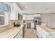 Stylish kitchen featuring granite countertops, stainless steel appliances, and white cabinets at 2151 Upton Ave, Sarasota, FL 34232