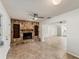 Inviting living room with a stone fireplace and built-in shelving, perfect for relaxation at 2151 Upton Ave, Sarasota, FL 34232
