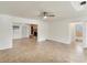 Bright living room featuring tile floors, a ceiling fan and an adjacent bathroom at 2151 Upton Ave, Sarasota, FL 34232