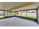 Enclosed back patio with views of fenced backyard at 2151 Upton Ave, Sarasota, FL 34232