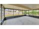 Enclosed back patio offers a screened outdoor space for relaxing or entertaining at 2151 Upton Ave, Sarasota, FL 34232