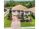 Overhead view of home showing its manicured landscaping, paved driveway, and two-car garage at 2177 Weaver Bird Ln, Venice, FL 34292