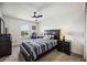Bedroom with carpeted floors, ceiling fan, window, and modern furniture at 2177 Weaver Bird Ln, Venice, FL 34292