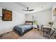 Bedroom with carpeted floors, ceiling fan, window, and desk at 2177 Weaver Bird Ln, Venice, FL 34292