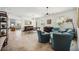 Bright and open living area featuring natural lighting, tile flooring, and a view of the pool table at 2177 Weaver Bird Ln, Venice, FL 34292