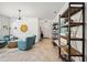 Bright living room with modern lighting, neutral paint, ceramic tile flooring, and stylish furnishings at 2177 Weaver Bird Ln, Venice, FL 34292