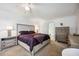 A well decorated primary bedroom with carpeted floors and lots of storage at 2177 Weaver Bird Ln, Venice, FL 34292