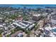 Aerial view of modern townhome community nestled in a vibrant urban setting, with city and water views at 221 Cosmopolitan Ct, Sarasota, FL 34236