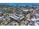 Aerial view of modern townhome community nestled in a vibrant urban setting, with city and water views at 221 Cosmopolitan Ct, Sarasota, FL 34236