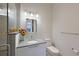 Stylish bathroom with a modern vanity, sleek mirror, and glass-enclosed shower, perfect for a refreshing experience at 221 Cosmopolitan Ct, Sarasota, FL 34236