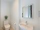 Bathroom featuring a sink and toilet at 221 Cosmopolitan Ct, Sarasota, FL 34236