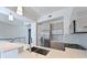 Contemporary kitchen with stainless steel appliances, quartz countertop, and tiled backsplash at 221 Cosmopolitan Ct, Sarasota, FL 34236
