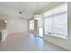 Bright open living space with tile flooring, large windows, and recessed lighting at 221 Cosmopolitan Ct, Sarasota, FL 34236