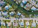 Bird's-eye view of beautiful waterfront houses with boat docks, swimming pools and serene canals at 234 85Th St, Holmes Beach, FL 34217
