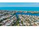 Scenic aerial view of waterfront homes nestled along winding canals and the breathtaking ocean at 234 85Th St, Holmes Beach, FL 34217