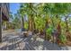 Outdoor space with a fire pit, seating, and lush landscaping at 234 85Th St, Holmes Beach, FL 34217