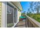 Spacious outdoor balcony with seating, offering a relaxing retreat with a canal view at 234 85Th St, Holmes Beach, FL 34217