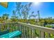 Scenic outdoor balcony with seating overlooking trees and canal providing a relaxing retreat at 234 85Th St, Holmes Beach, FL 34217