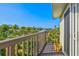 Balcony offering a view of tropical trees, a canal, and other waterfront homes on a sunny day at 234 85Th St, Holmes Beach, FL 34217