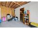 Basement with gray epoxy floors and storage shelves at 234 85Th St, Holmes Beach, FL 34217